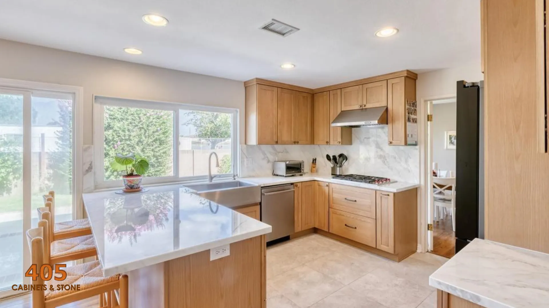 oak kitchen cabinets with white countertops